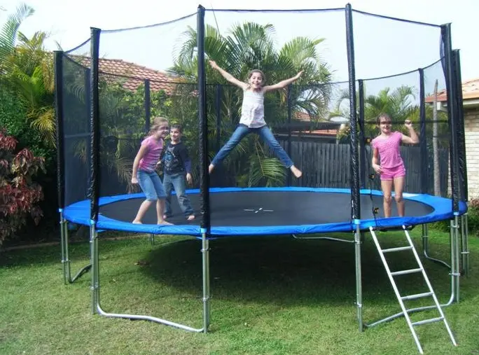 Kids jumping on an outdoor trampoline